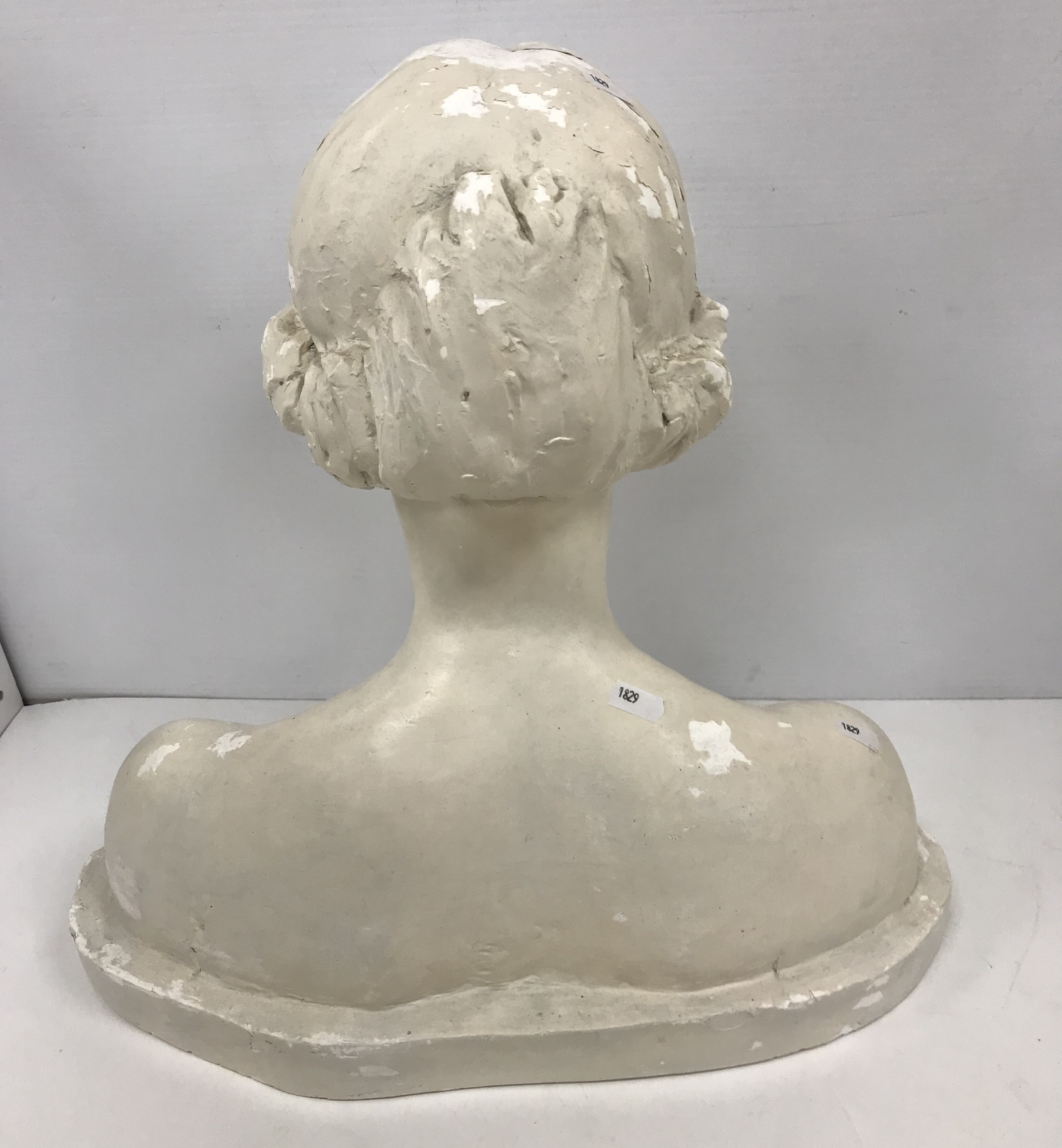 A white painted plaster bust portrait sculpture of a young woman, eyes closed, - Image 2 of 2