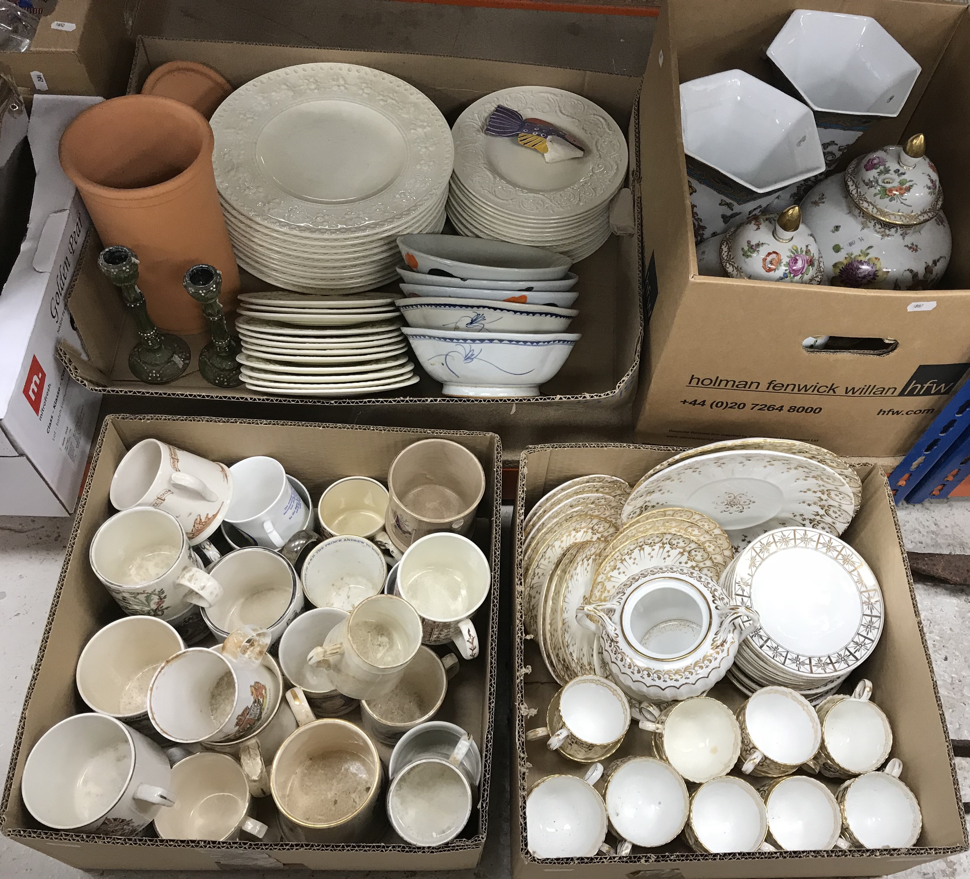 Four boxes of miscellaneous china to include a box of Royal commemorative mugs and a large