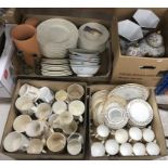 Four boxes of miscellaneous china to include a box of Royal commemorative mugs and a large
