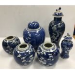 A collection of six Chinese prunus blossom decorated items including a baluster shaped vase and