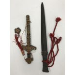 A Chinese bronze sword or dagger with integral relief work decorated handle,