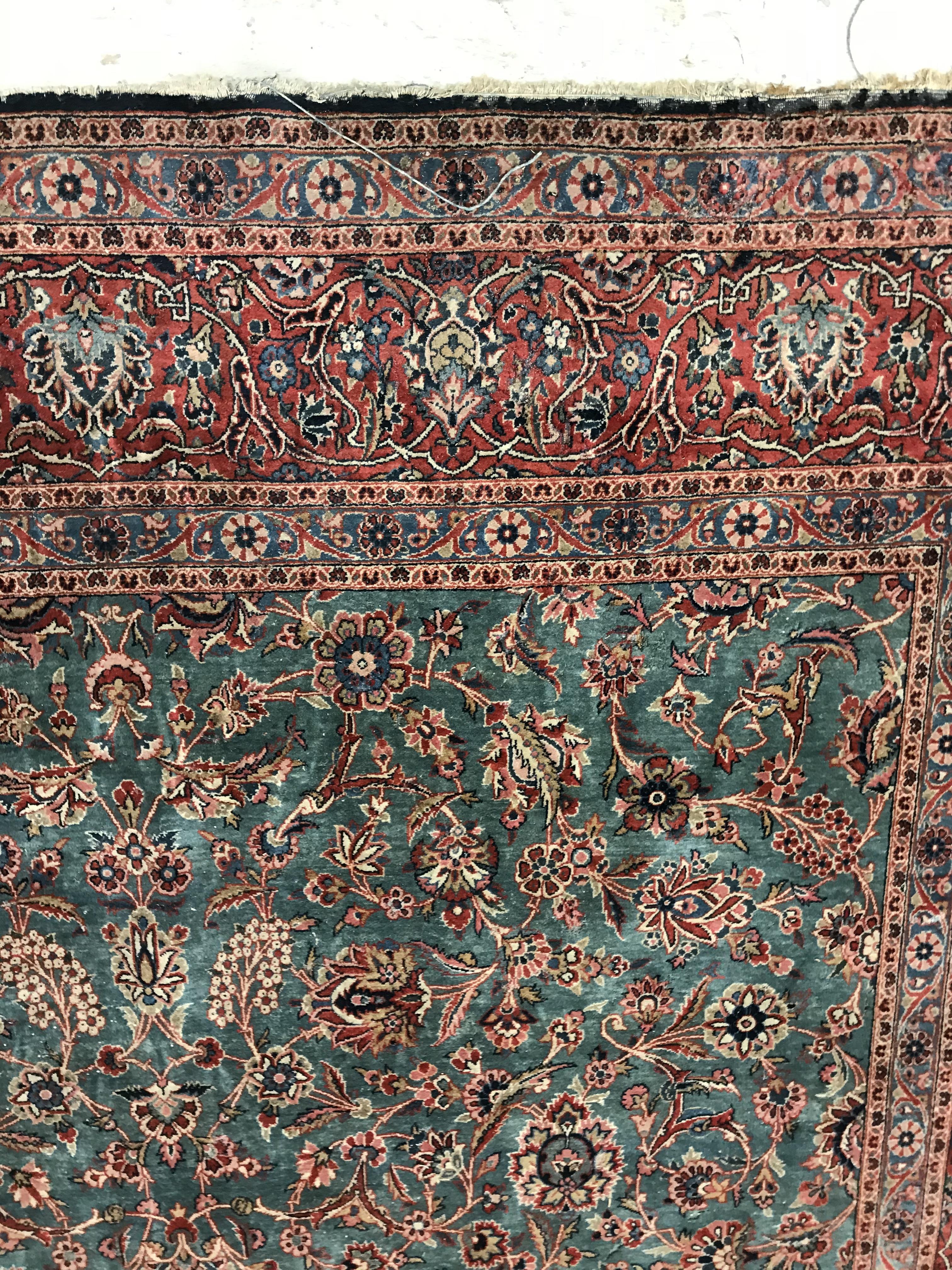 A Persian carpet, the central panel set with all-over scrolling foliate design on a teal ground, - Bild 3 aus 41