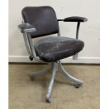 A vintage Tansad office chair with cast aluminium frame, burgundy leatherette upholstery,