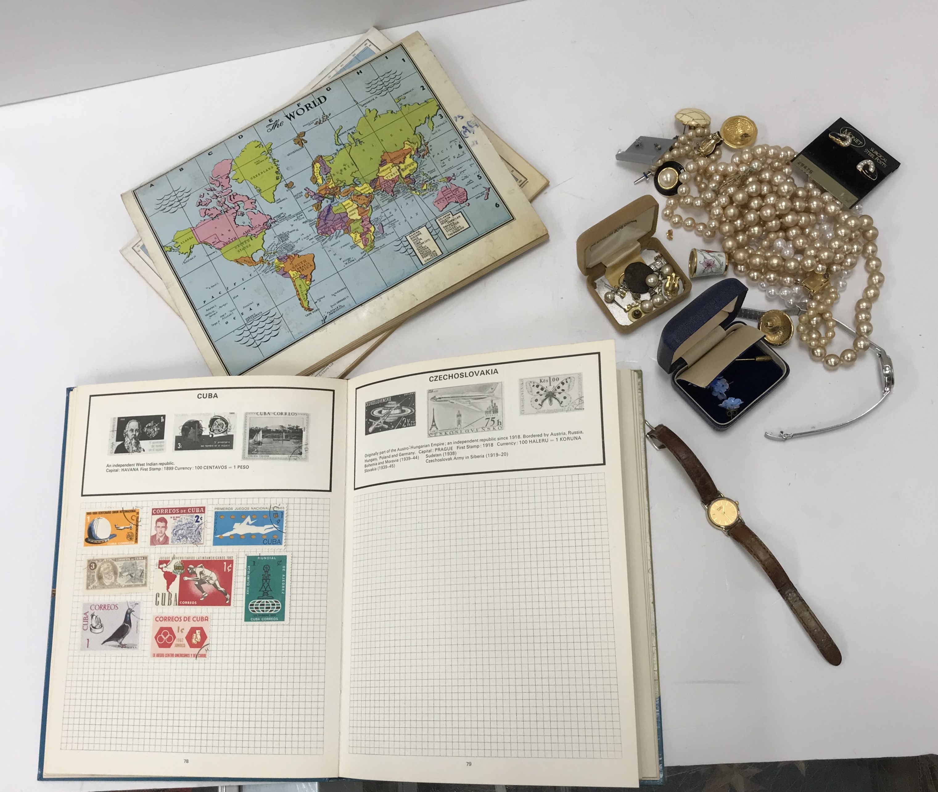 A box and contents of three albums containing a small quantity of British and World stamps,