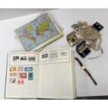 A box and contents of three albums containing a small quantity of British and World stamps,