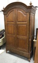 An And So To Bed mahogany wardrobe in the 18th Century French taste,