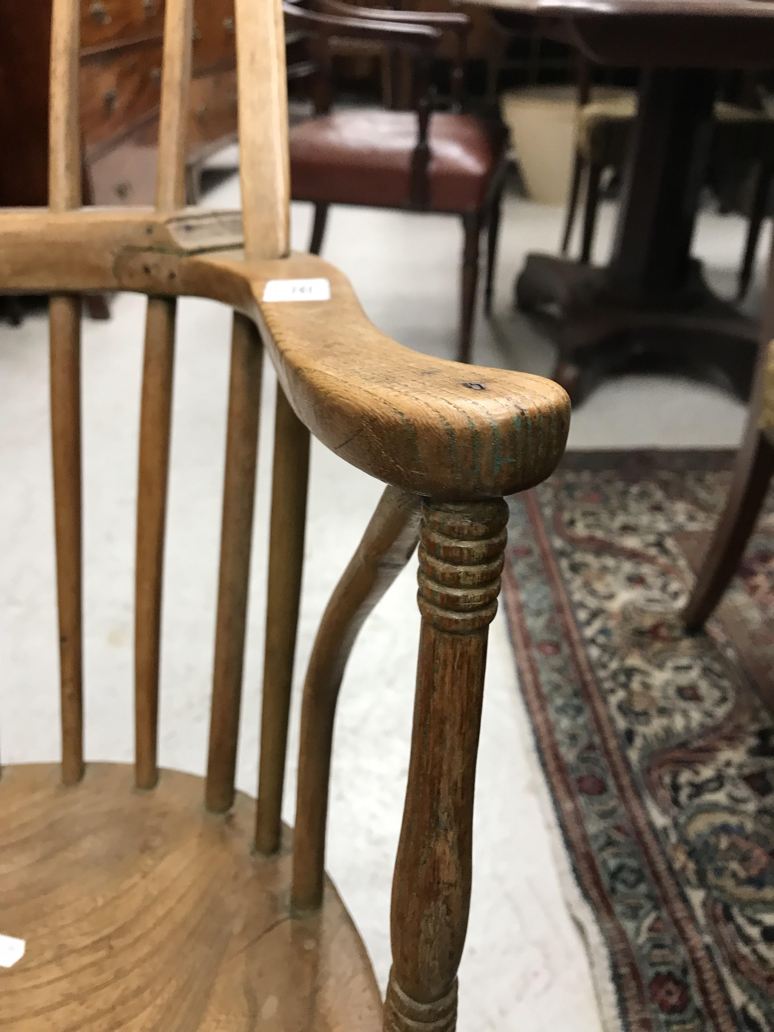 An early 19th Century West Country ash and elm stick back elbow chair, - Image 31 of 39