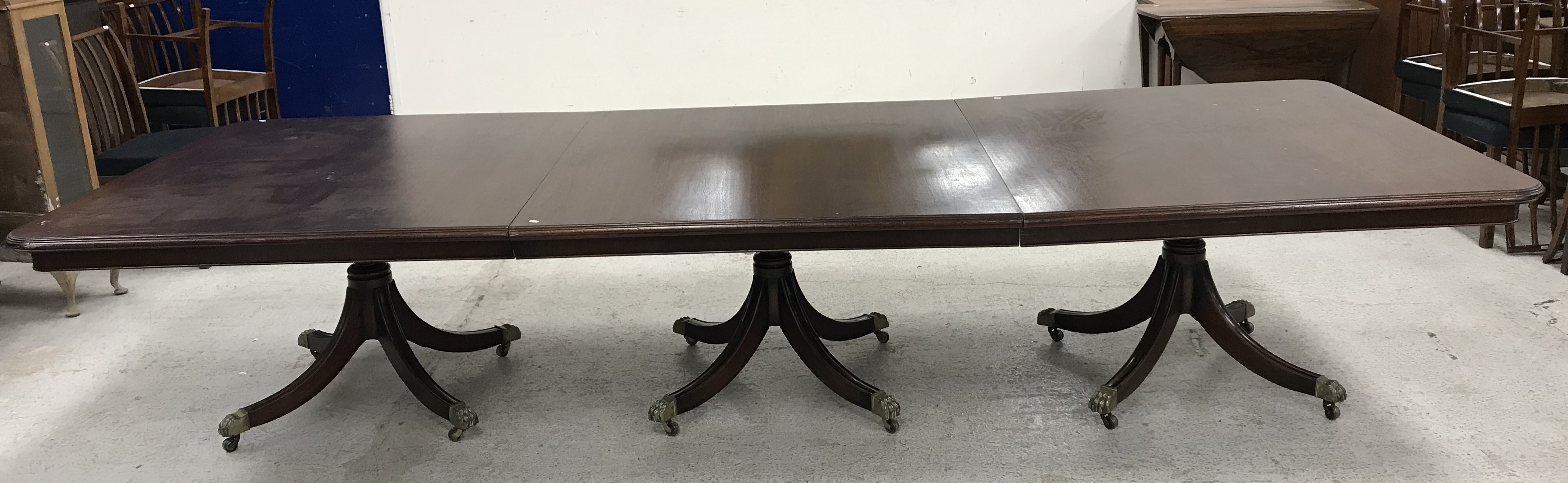 A modern mahogany triple pillar dining or board room table in the Georgian style on splayed - Image 2 of 40