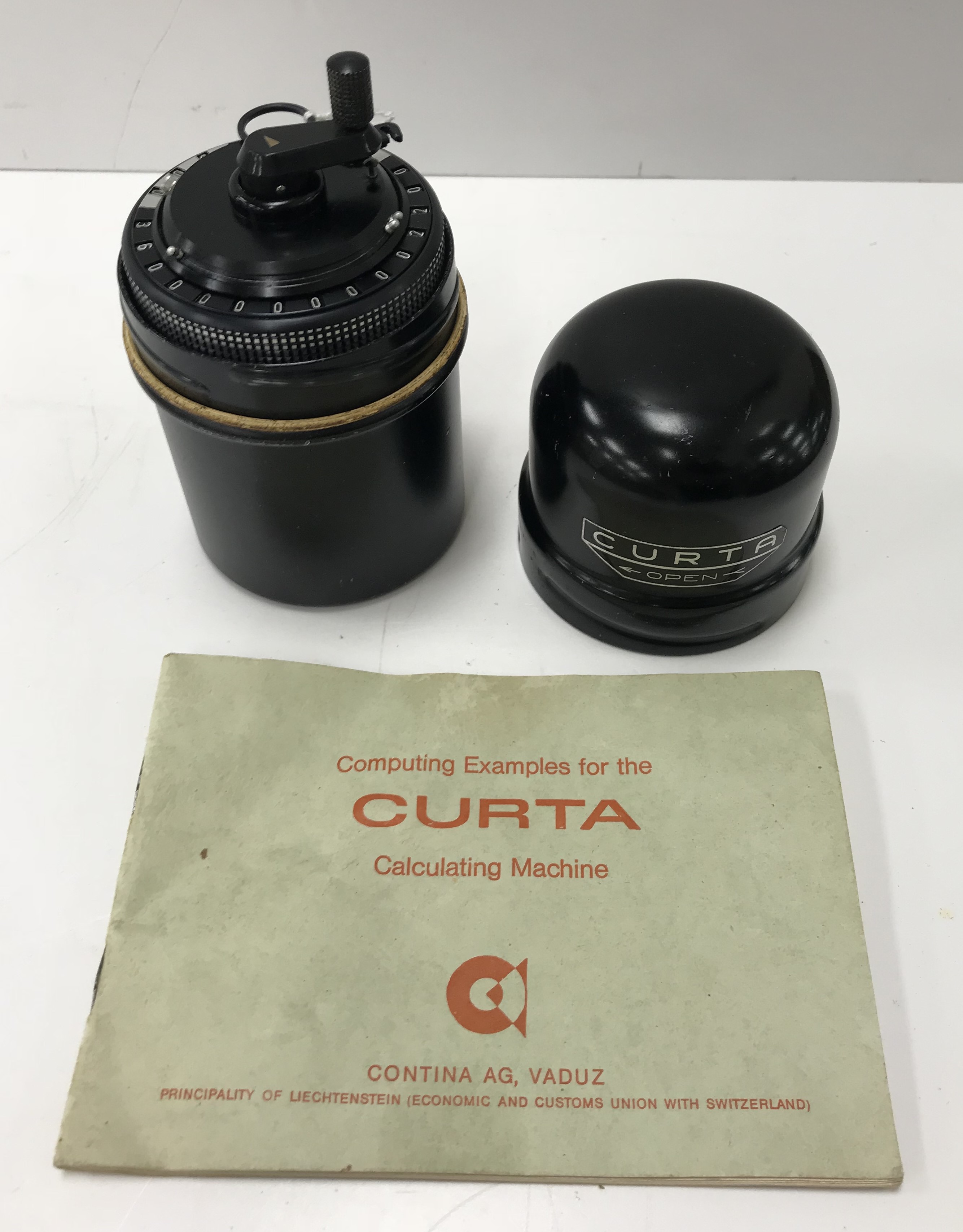 A Curta type 2 calculator with military green type main body inscribed to base "Type 2 No 523646