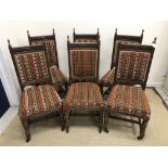 A set of six Victorian oak framed dining chairs,