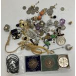 A small collection of various costume jewellery, earrings, pendants, coins,