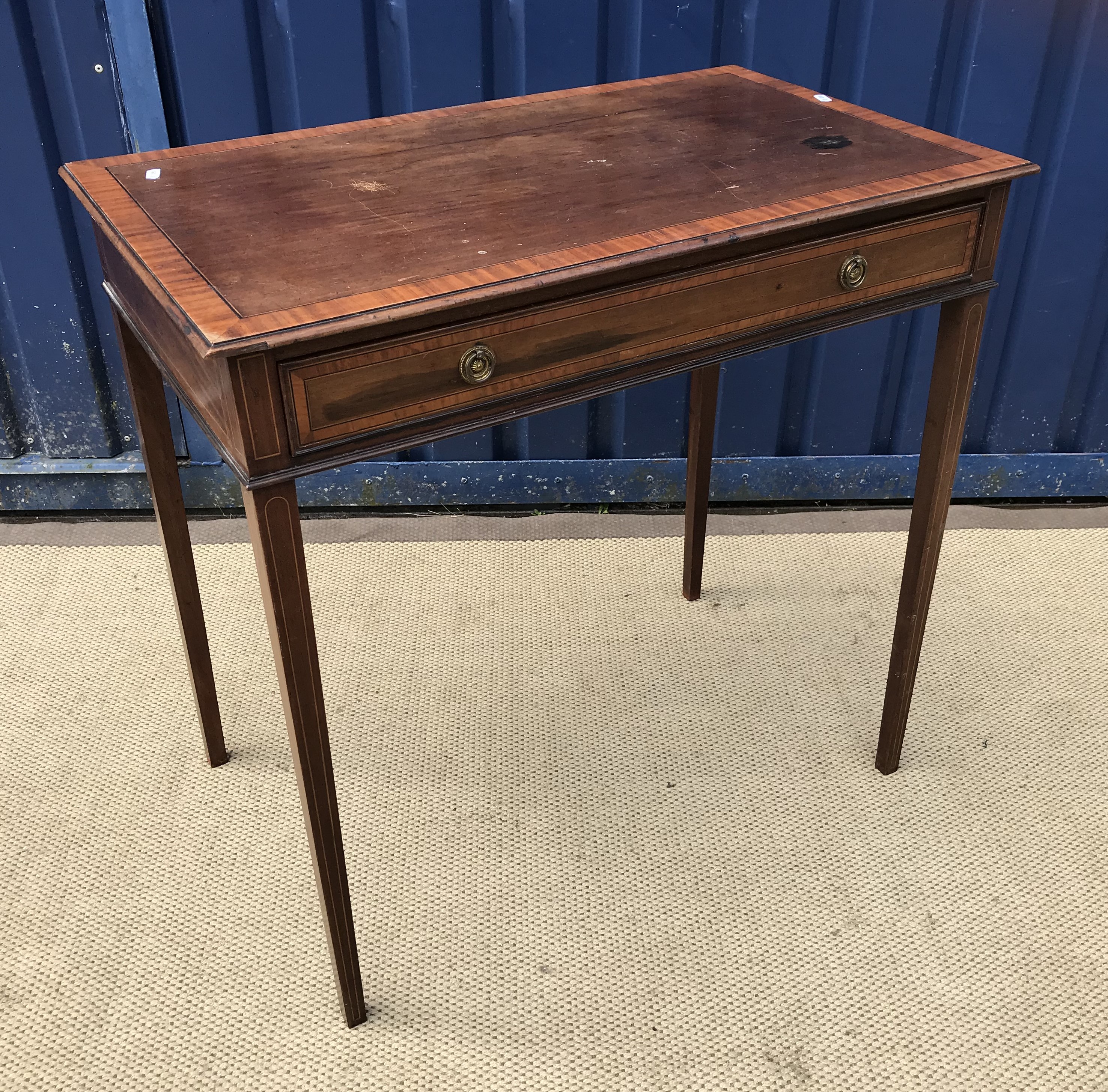 An Edwardian mahogany and satinwood cross-banded single drawer side table on square tapered legs,