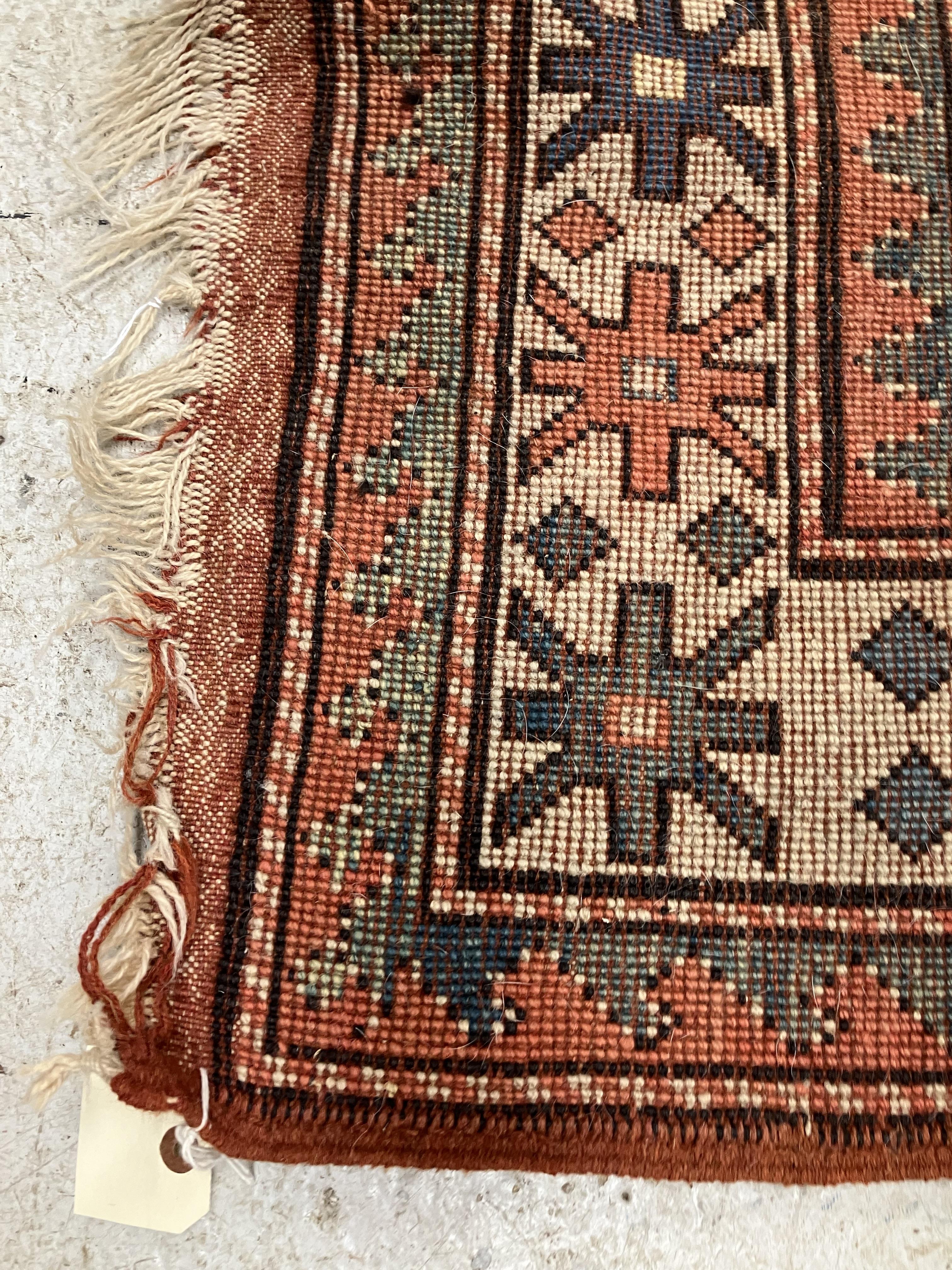 A fine Turkish carpet, - Image 16 of 16