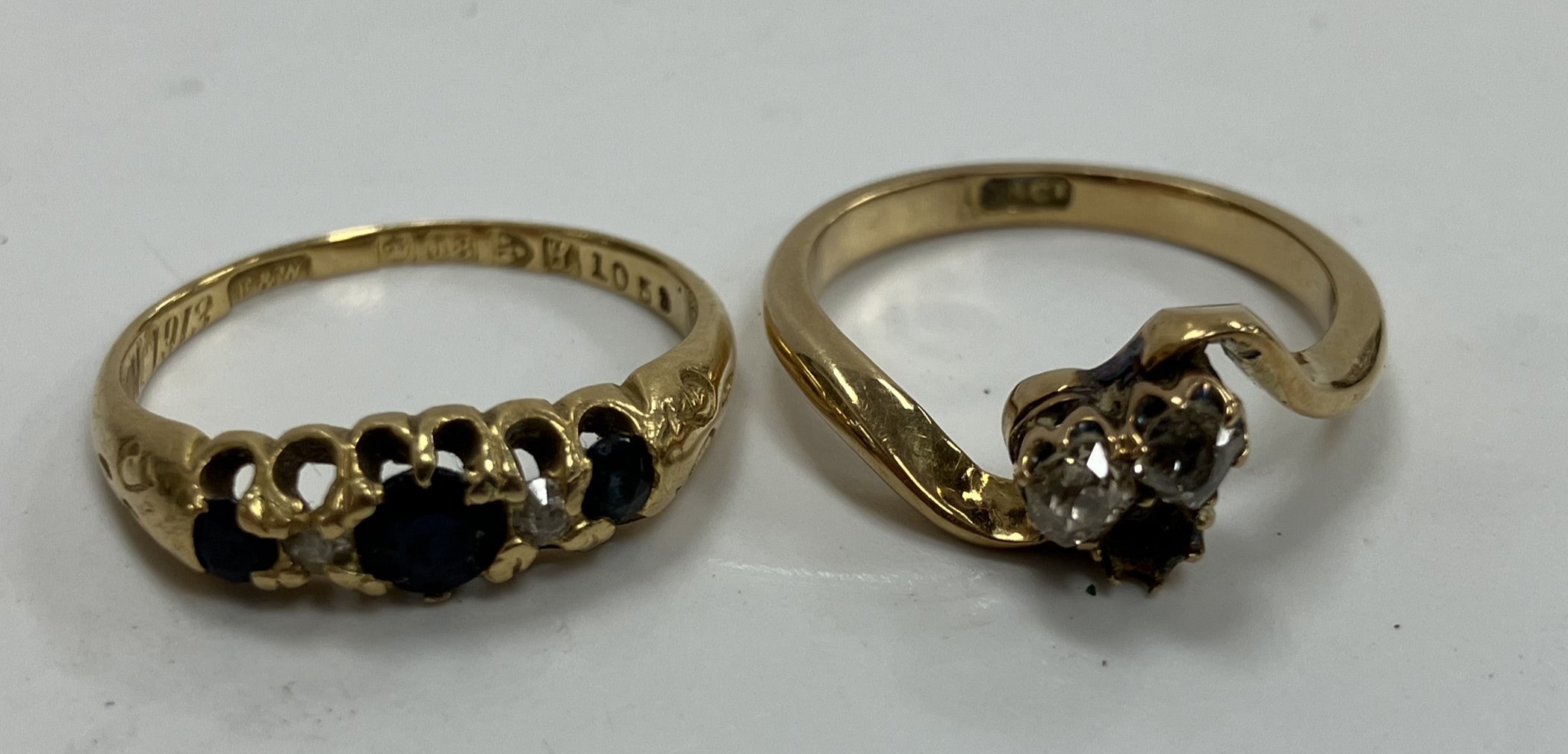 An 18 carat gold plain wedding band, size P, an 18 carat gold sapphire and diamond five stone ring, - Image 2 of 3