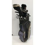 A canvas golf bag and contents of five various golf woods, seven various irons and two putters, etc.