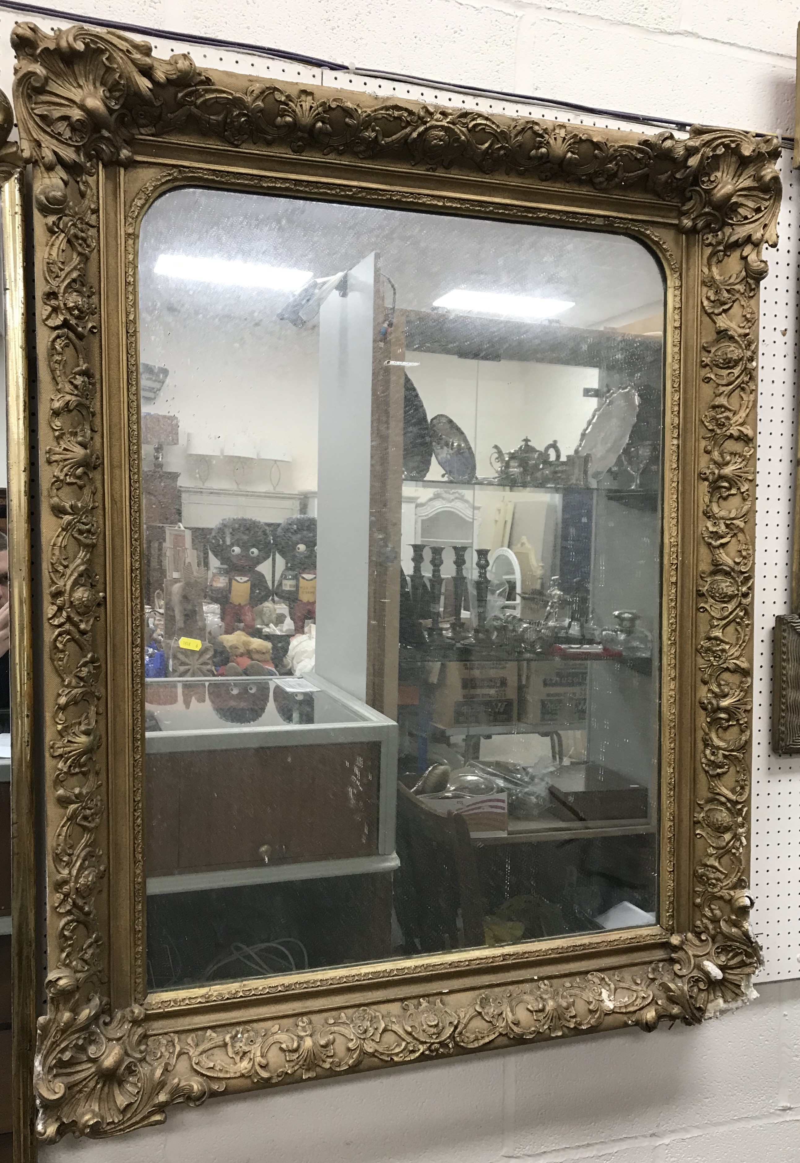 A Victorian giltwood and gesso framed rectangular overmantel mirror with plain plate,