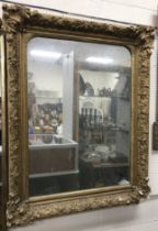 A Victorian giltwood and gesso framed rectangular overmantel mirror with plain plate,