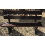 A Bristish Railways bench with wooden slats on cast iron ends 152 cm wide