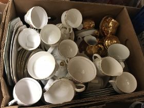 A box of various china wares to include plates, cups and saucers, etc.