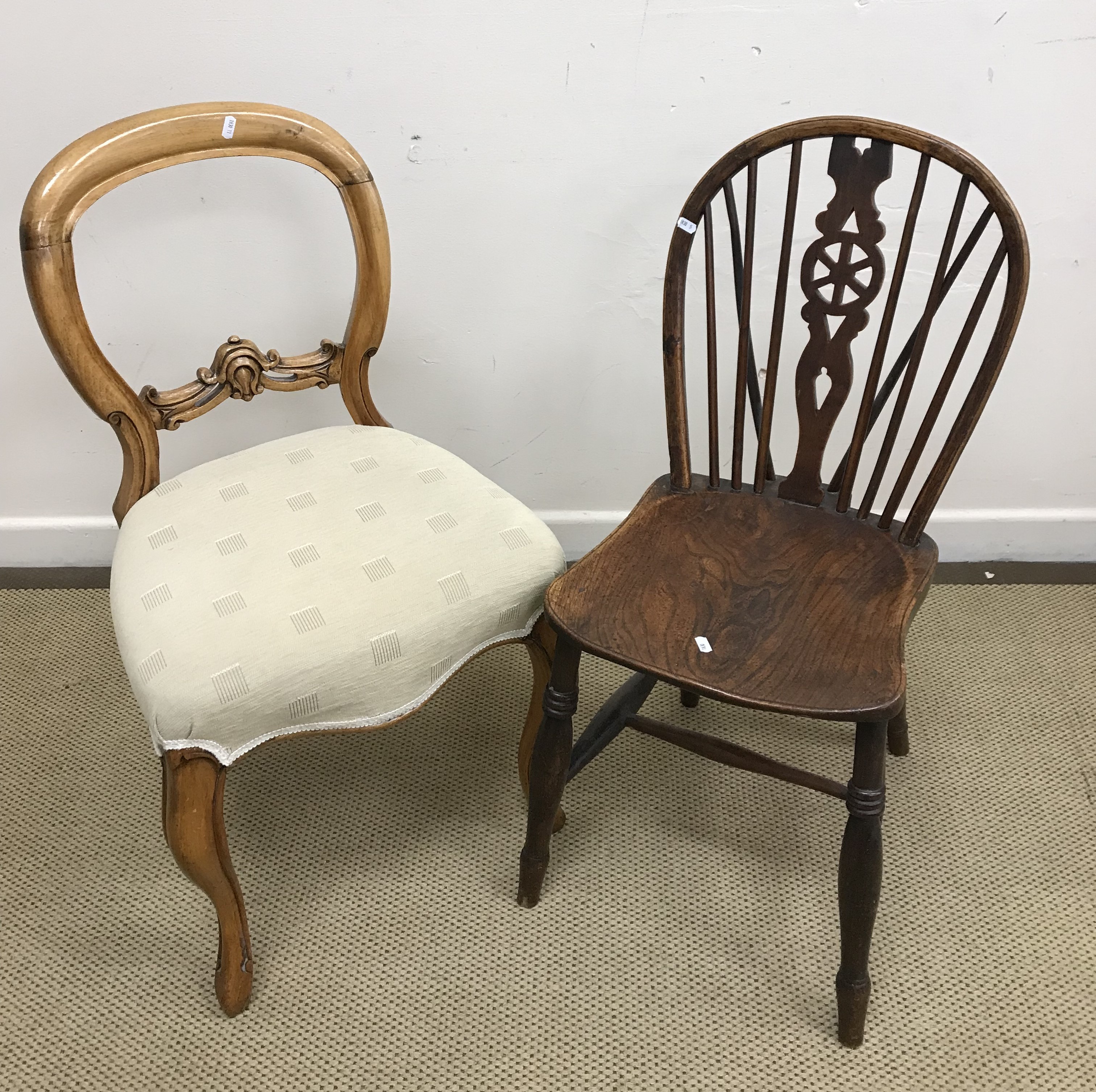 A 19th Century beech and elm Oxford bar back chair, a North Country rush seat spindle back chair,