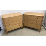 A pair of modern oak three drawer chests, the plain top with plank detail and rounded top corners,