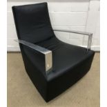 A 1990s Ligne Roset black leather upholstered "Neo" duchesse brisée with polished steel open arms