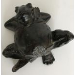 A bronze figure of a frog lying down 16.