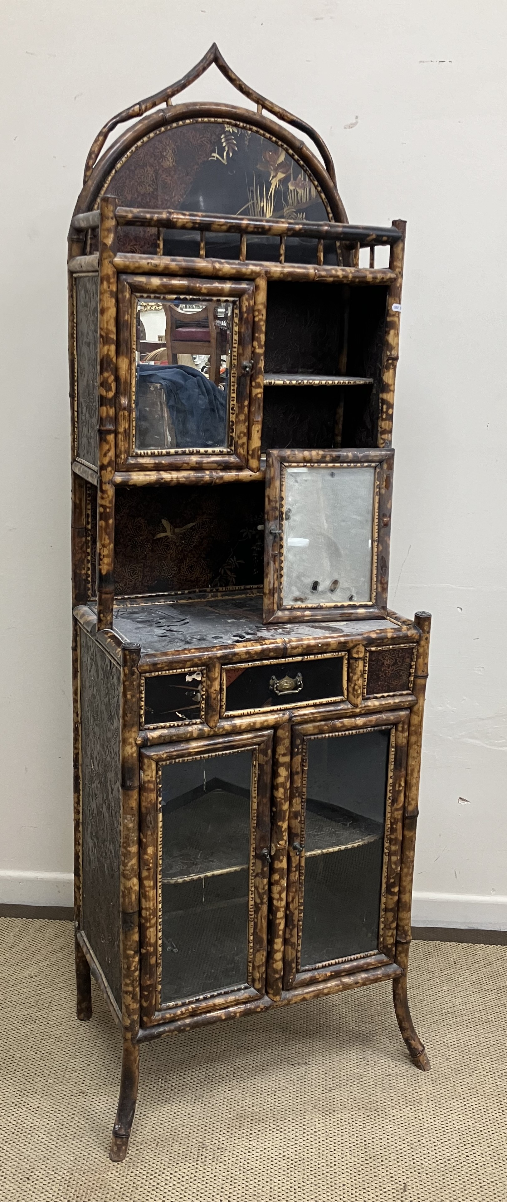 A Victorian bamboo framed side cabinet in the Aesthetic taste with black lacquered and Japanned