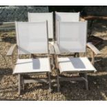 Four wooden garden chairs with fabric seats and backs