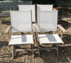 Four wooden garden chairs with fabric seats and backs
