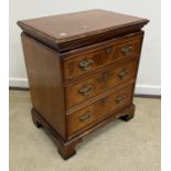 A modern reproduction walnut and feather-banded chest in the early 18th Century style,