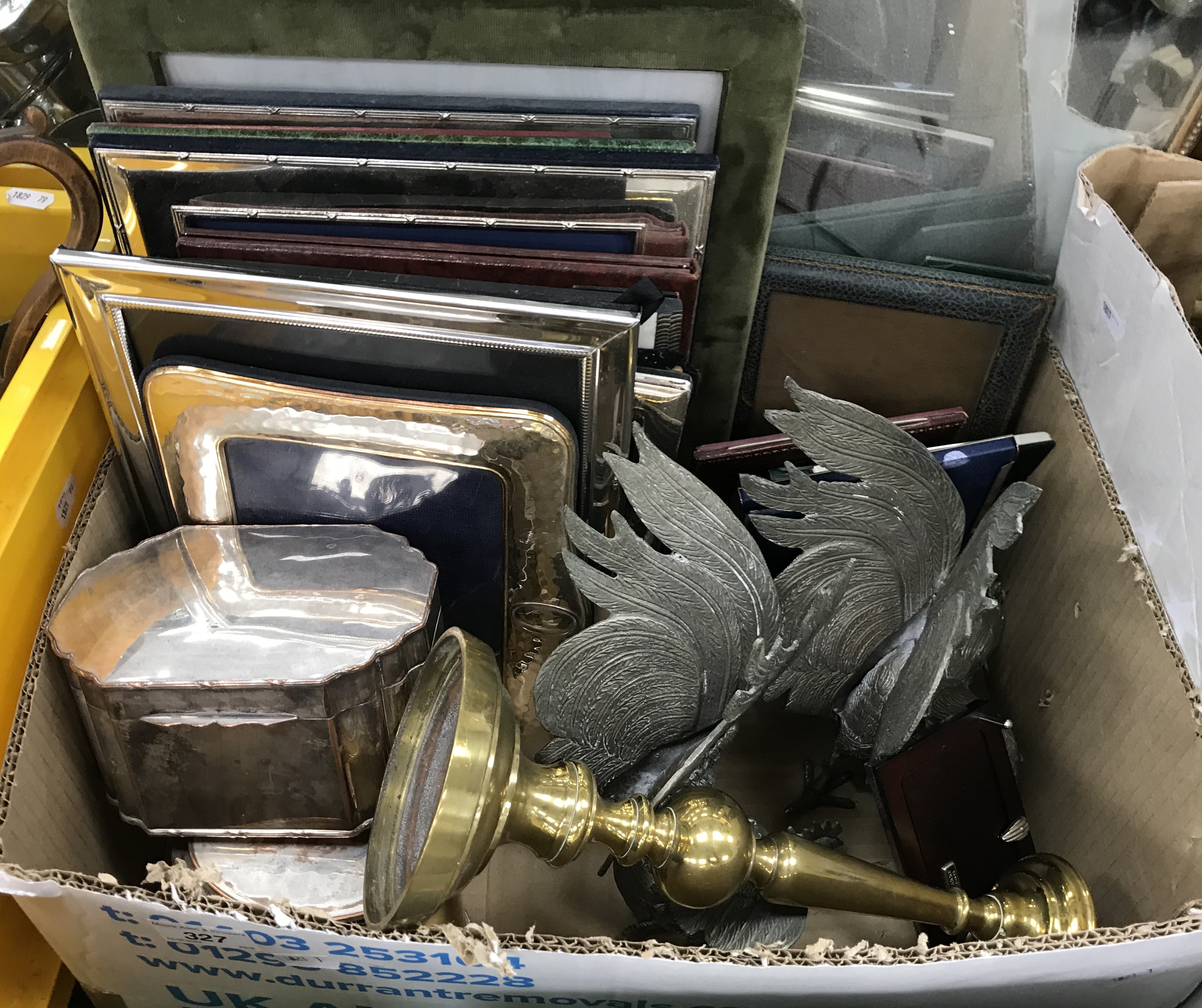 A box containing 17 various photograph frames, a plated on copper tea caddy,