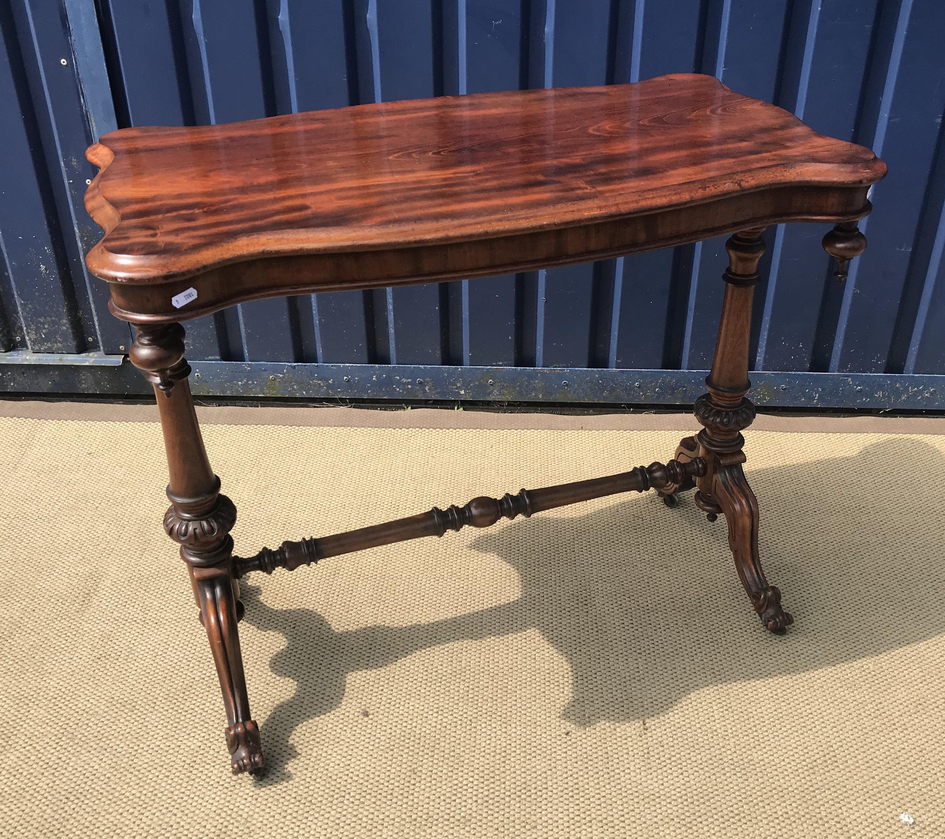 An Edwardian mahogany and inlaid revolving bookcase,