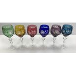 A set of six 20th Century Bohemian overlaid cut glass hock glasses in amethyst, blue, cranberry,