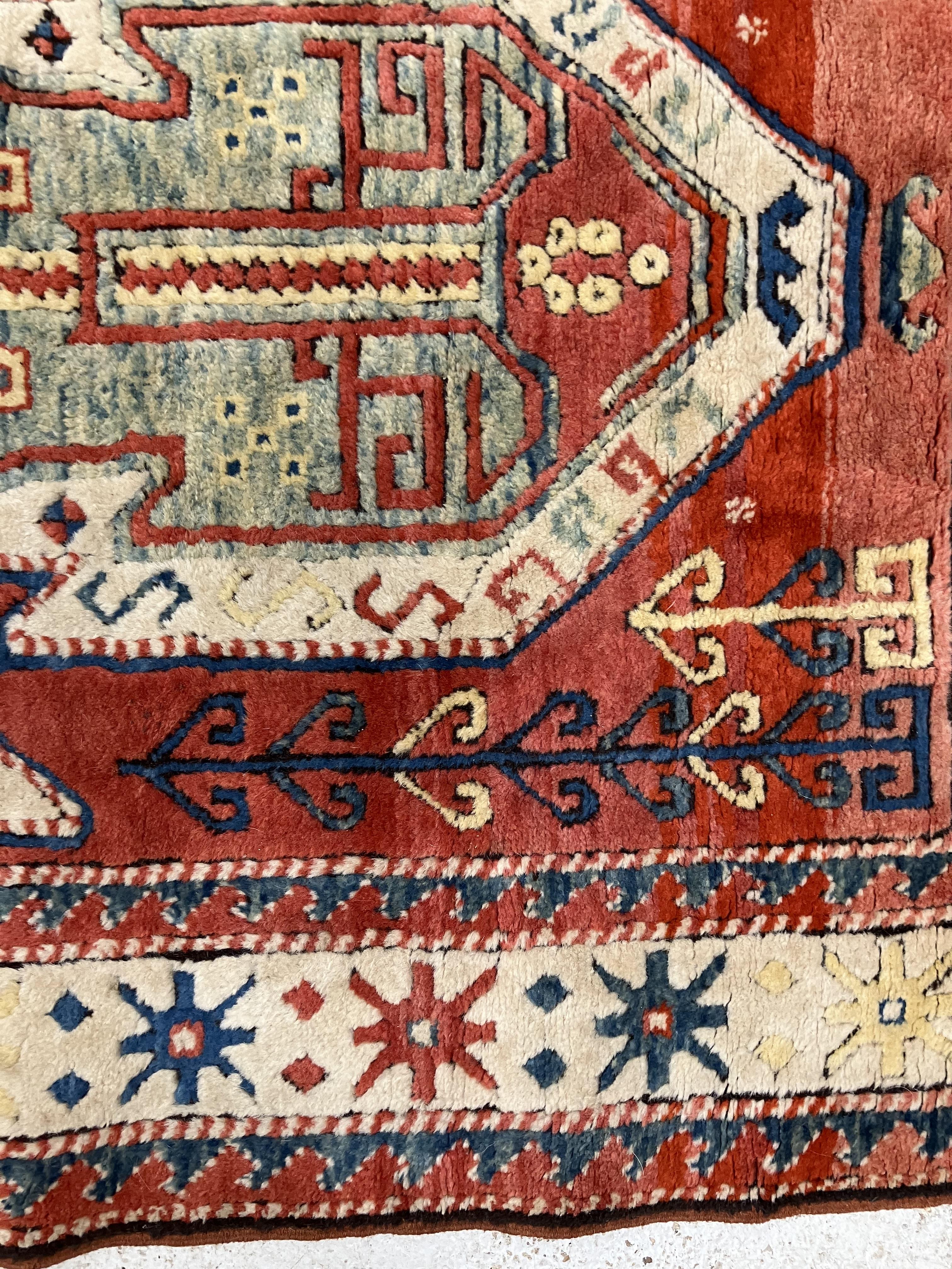 A fine Turkish carpet, - Image 4 of 16