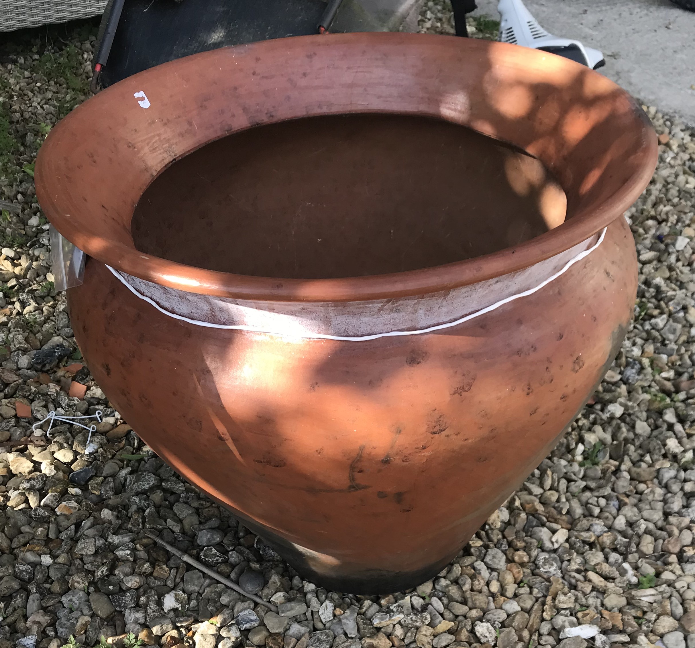 A Nigerian Abuja brown glazed terracotta pot,