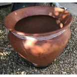 A Nigerian Abuja brown glazed terracotta pot,