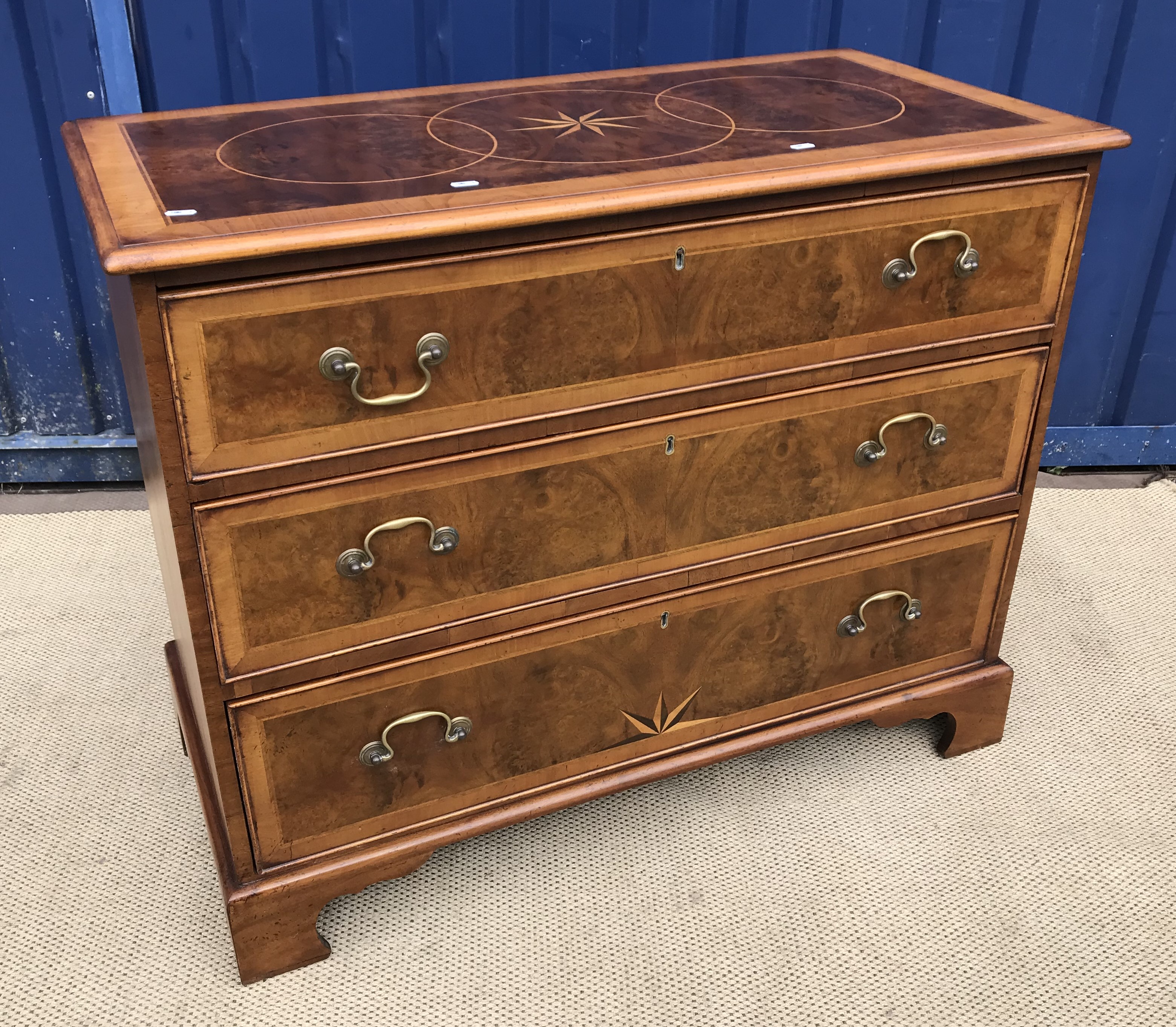 A walnut and parquetry inlaid chest in the early 18th Century style,