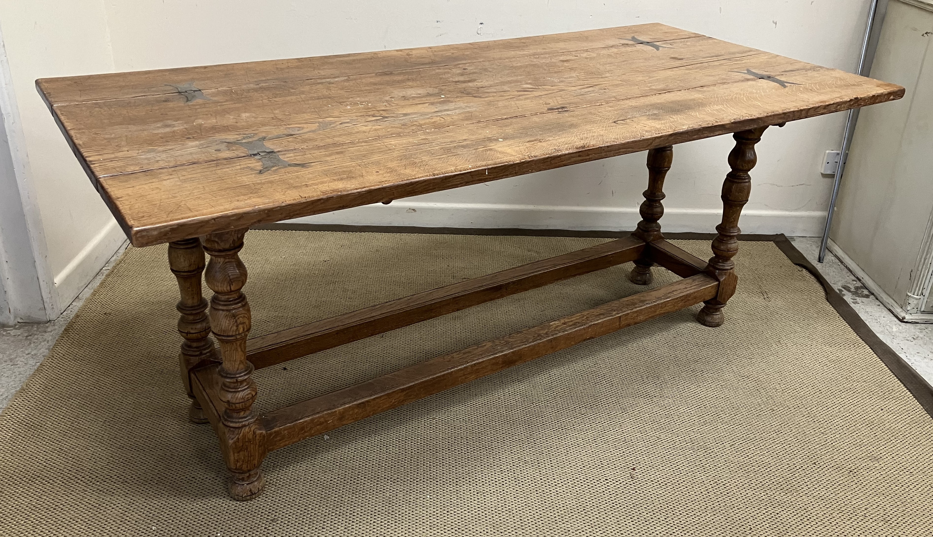 A modern oak dining table in the 17th Century manner,