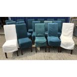 A set of twelve OKA high back upholstered dining chairs on square tapered legs with green linen