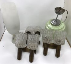 Three mid 20th Century twin branch wall lights with glass shades and brass mounts together with a