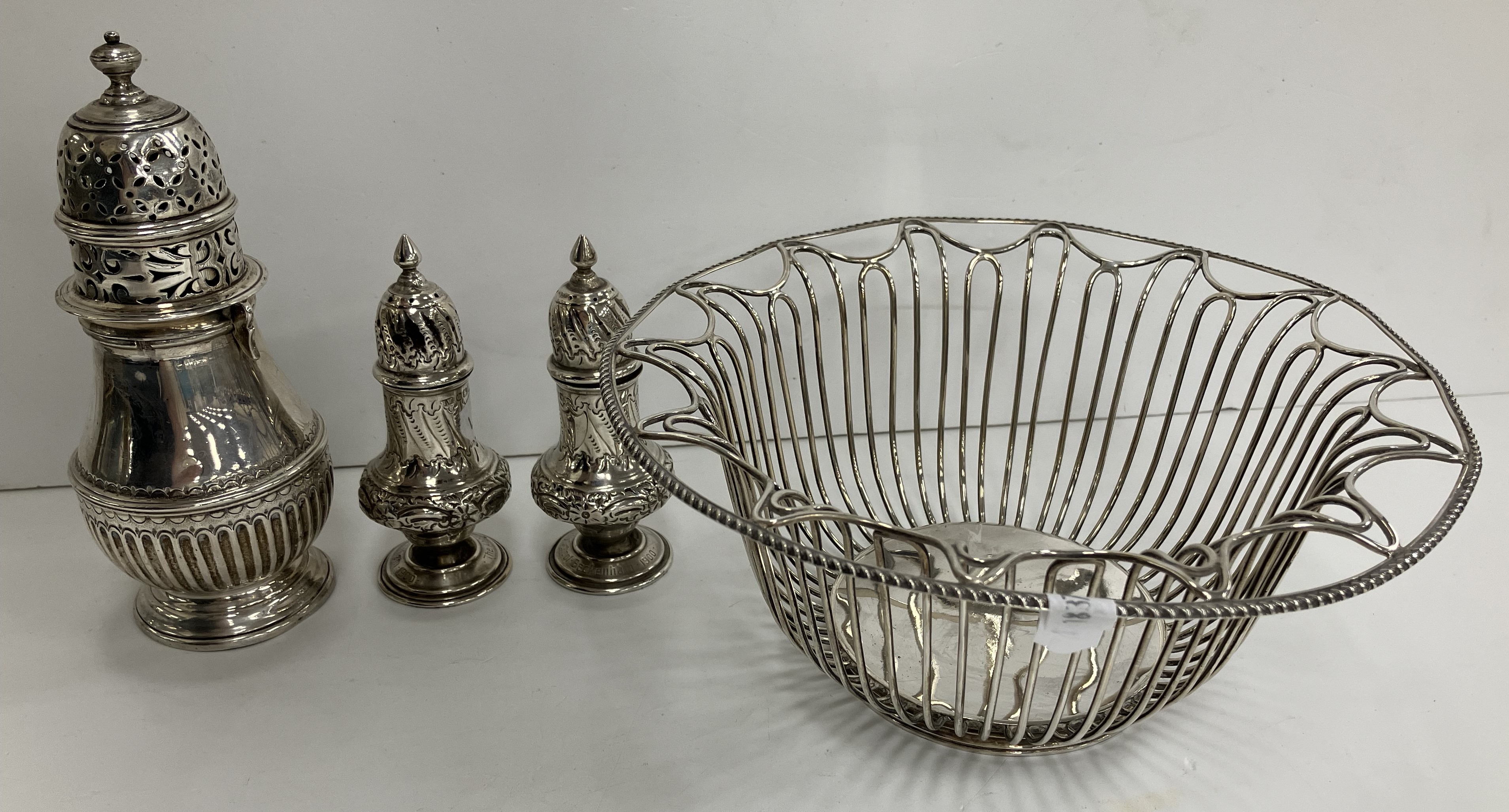 An Edwardian silver wire work fruit basket of circular form with gadrooned edge (by Roberts & Belk