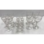 A set of circa 1920 grape and vine etched drinking glasses on enamel twist stems in the 18th