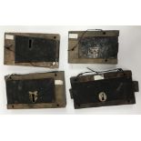 A collection of four various 19th Century wooden mounted iron door locks, largest 28 cm x 16 cm x 4.