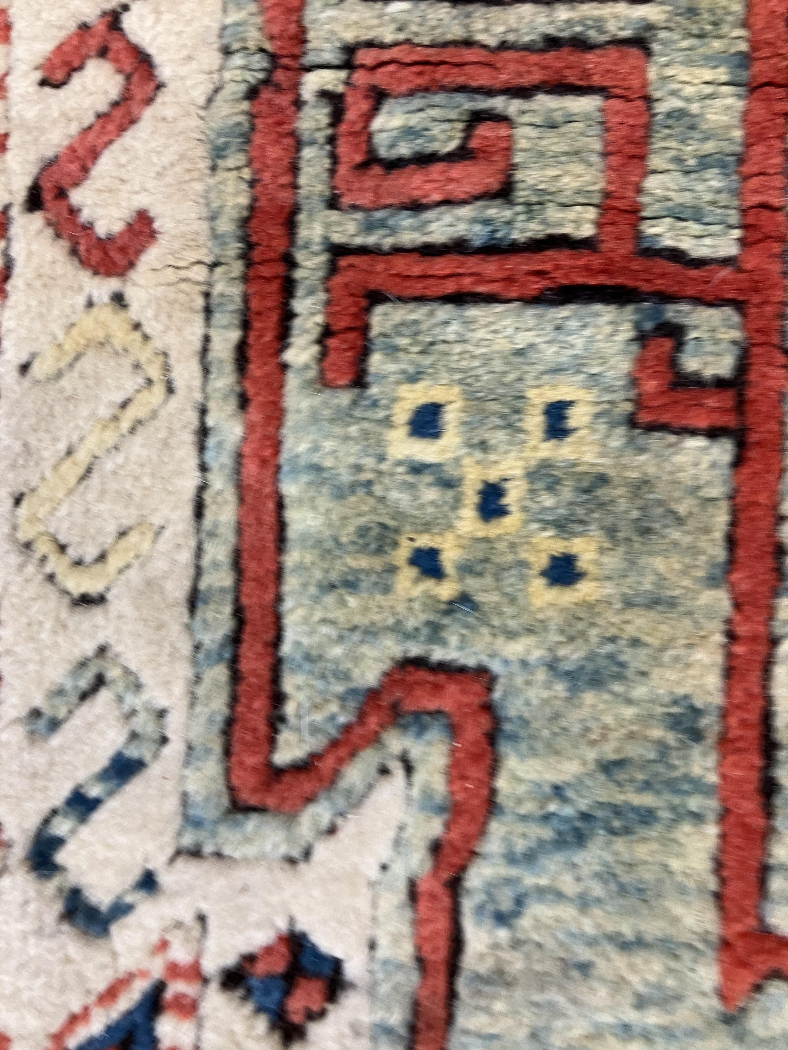 A fine Turkish carpet, - Image 14 of 16