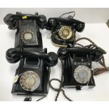 A collection of four vintage black telephones to include a Bell telephone MFG Company example with
