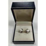 A pair of 18 carat gold mounted pearl, sapphire and diamond ear studs,