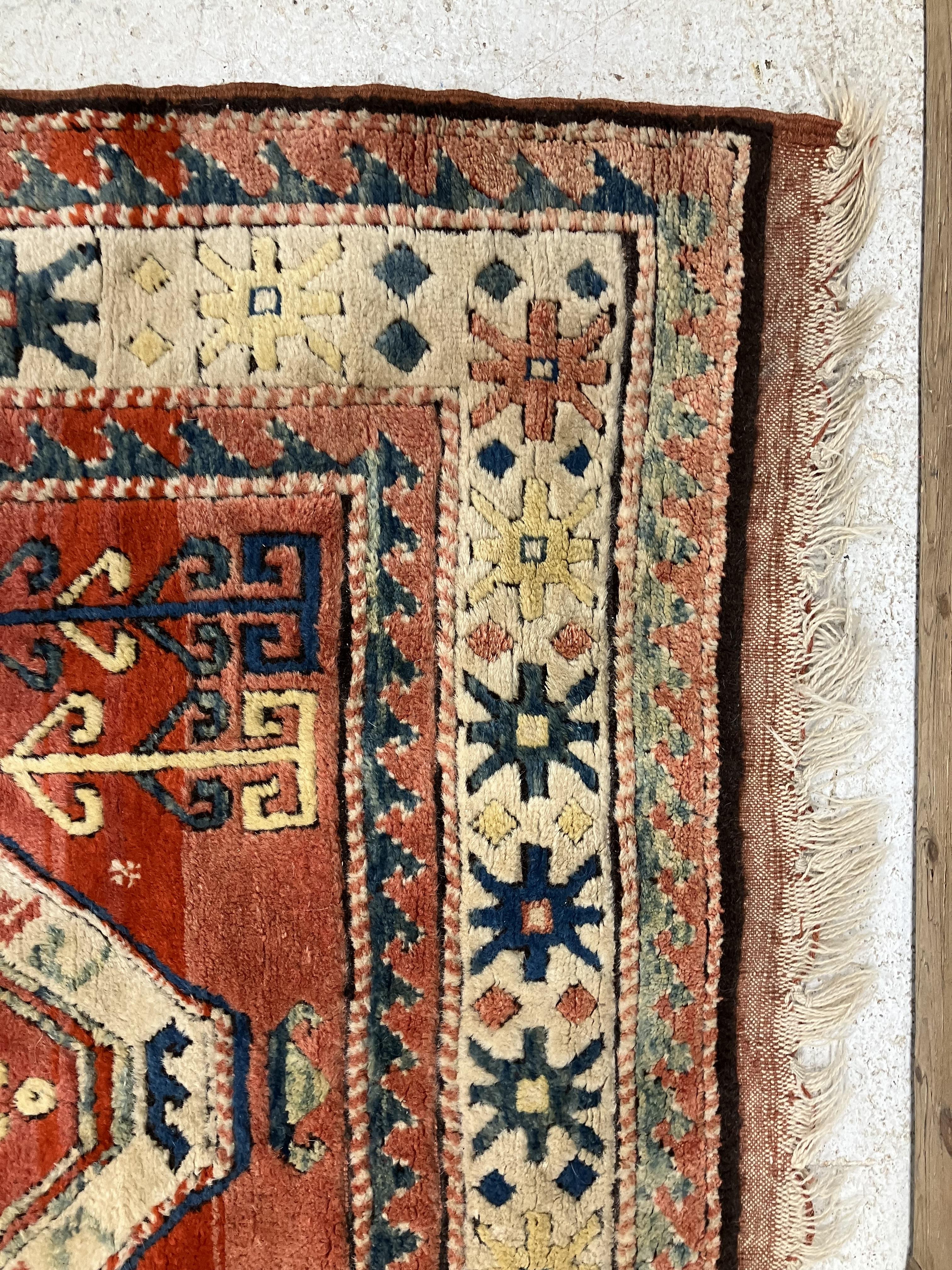 A fine Turkish carpet, - Image 2 of 16