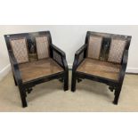 A pair of early 20th Century black lacquered and chinoiserie decorated caned low arm chairs on