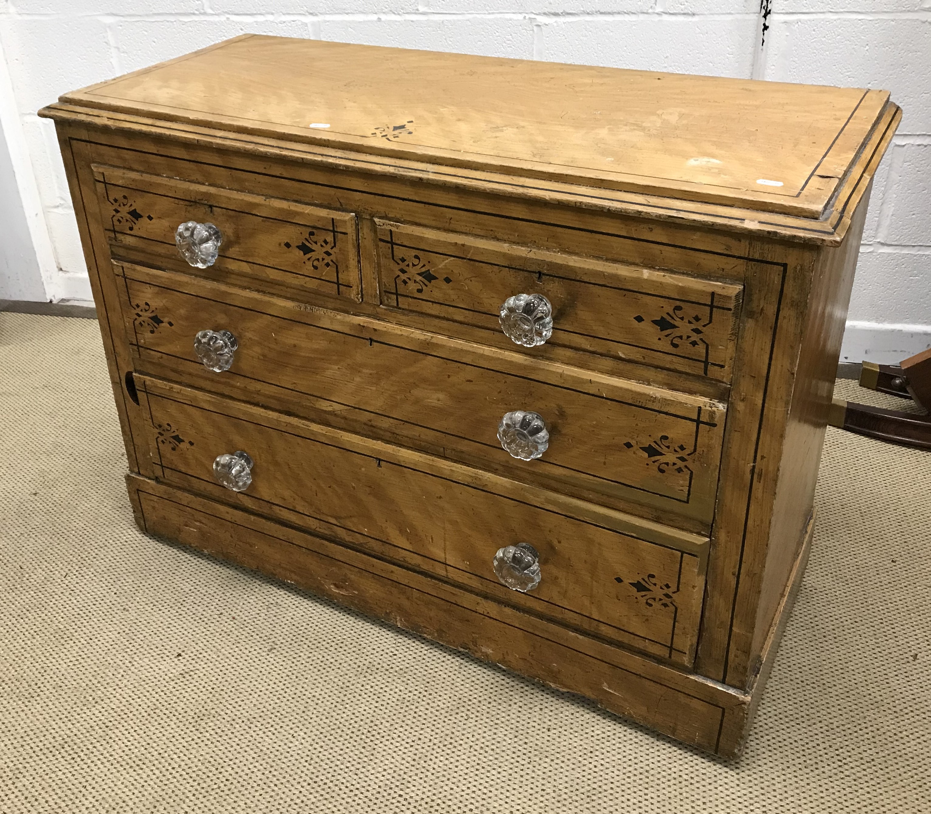 A Victorian painted pine chest of two short over two long drawers with glass handles,